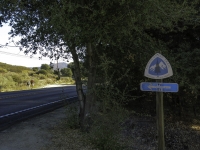 sign pointing to the Pacific Crest Trail across the highway