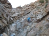 scrambing-up-the-rock-past-the-water-fall