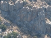 zoom in towards the rockclimbers