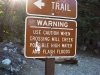 Trail sign at wash