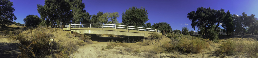 On the eastern side of the bridge on Highway 79 near the fire station that you cannot cross under but must go up and across the 79 to connect back up to the Pacific Crest Trail