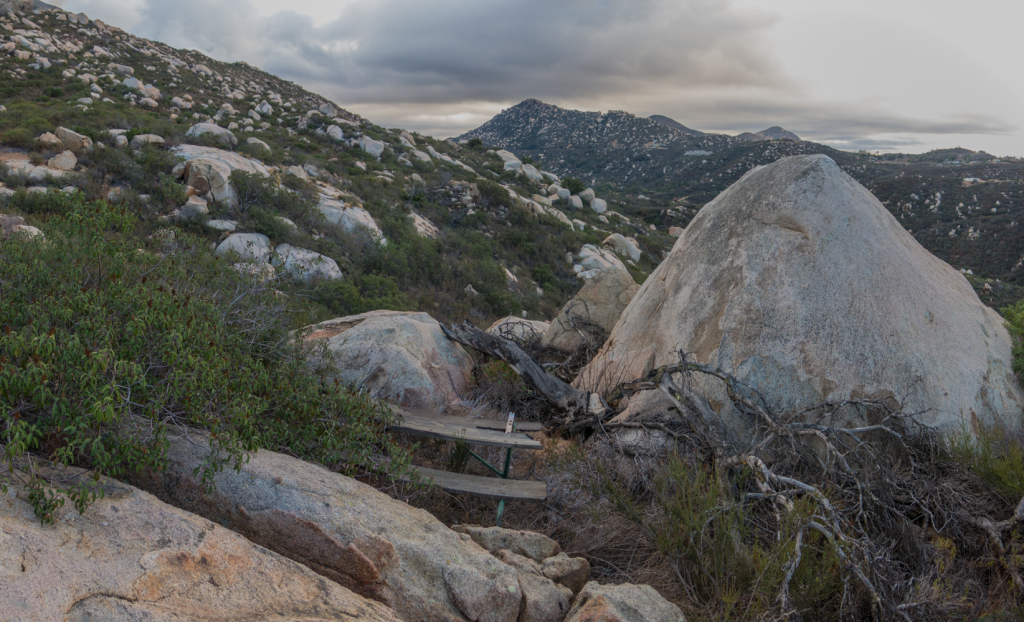 An old picnic table hidden amongst the brush along the Warren Canyon Trail