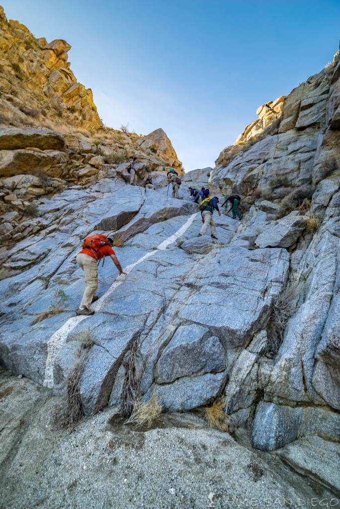 The group making its way up the last large waterfall at the end of the canyon