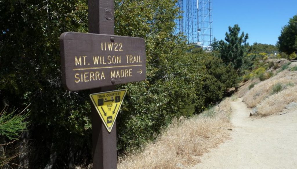 Mt Wilson Sierra Madre Trail Sign at the far end of the parking lot just below the Cosmic Cafe