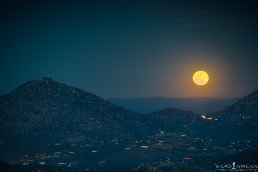 The full moon rising up behind Mt Woodson taken from the top of Black Mountain