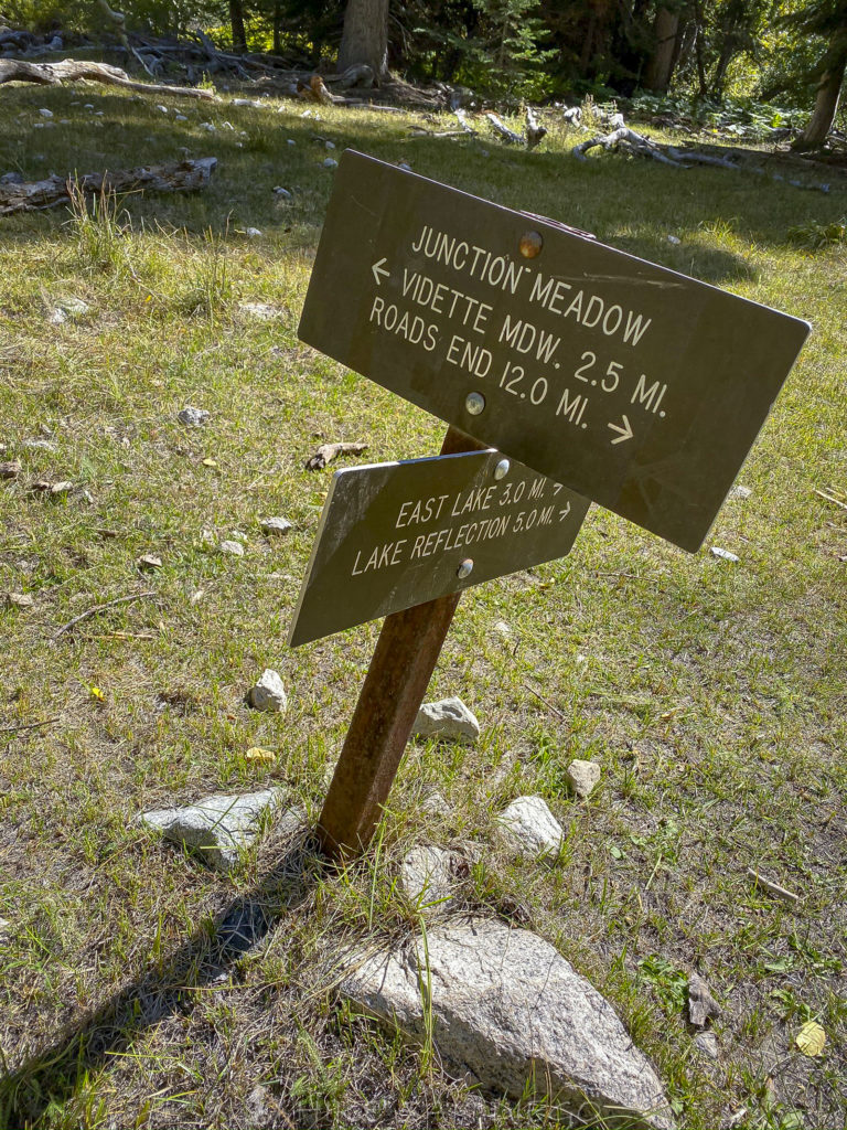 The confusing mileage at the Junction Meadows sign 